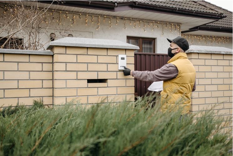 An installer ringing the doorbell