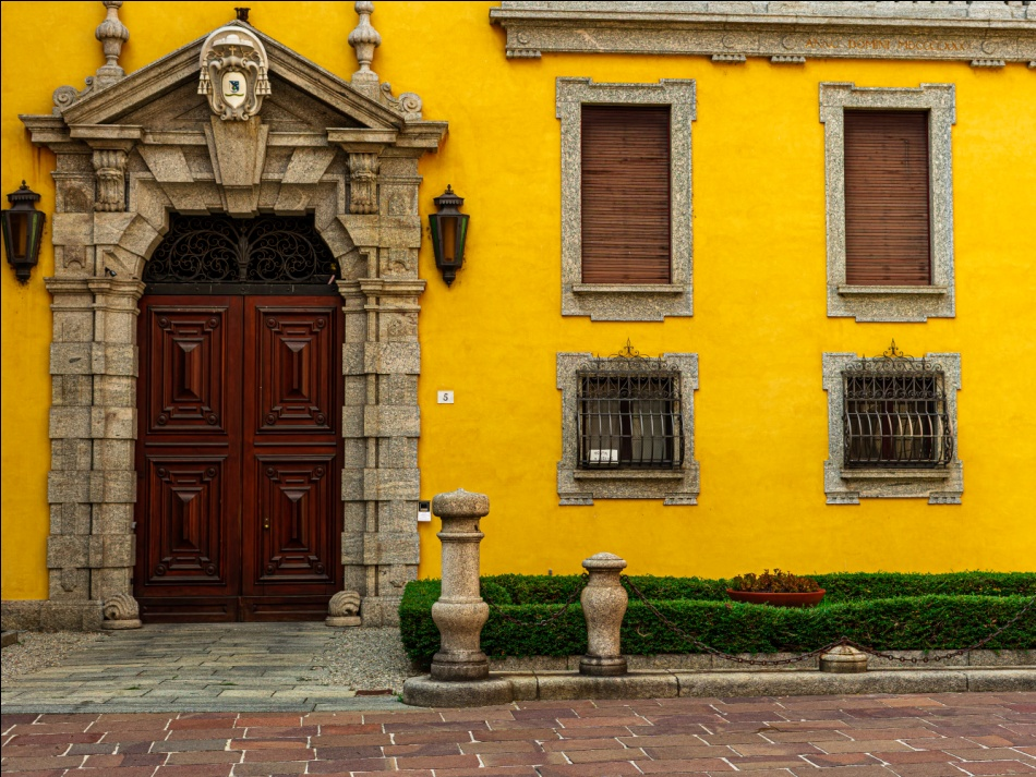 Wooden front door with yellow house