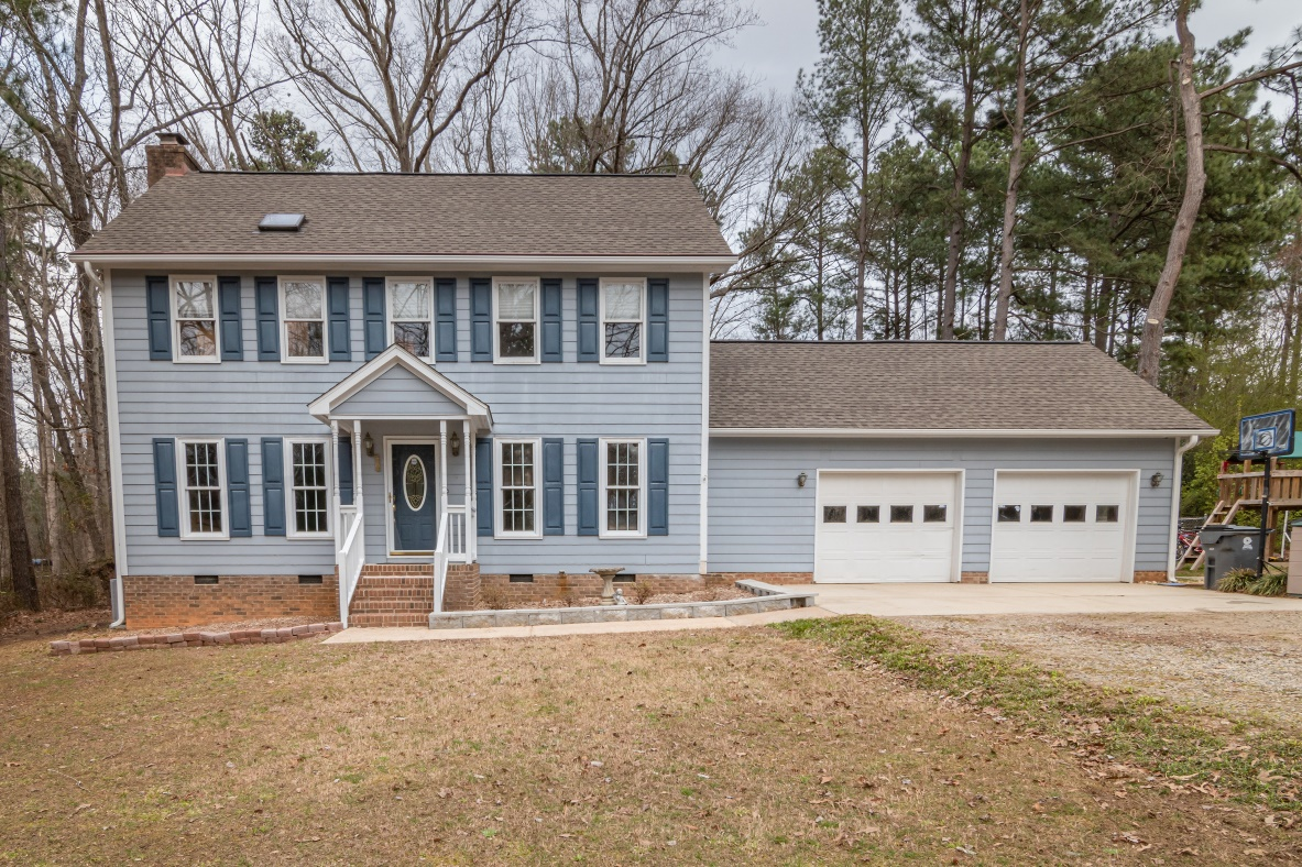 a house with carriage house garage doors