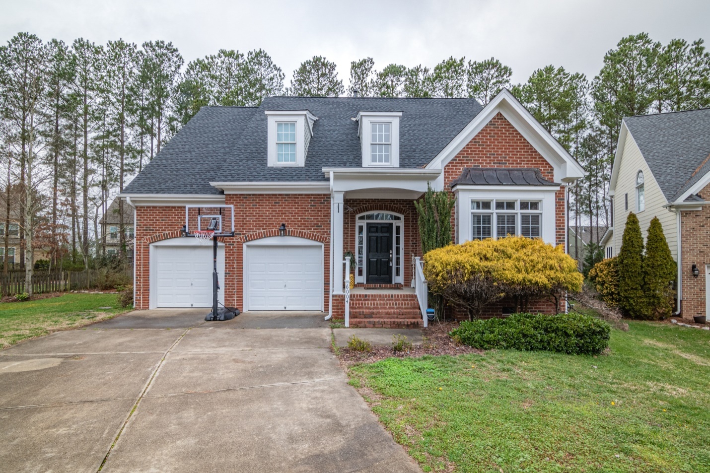 a white garage door at a brick house