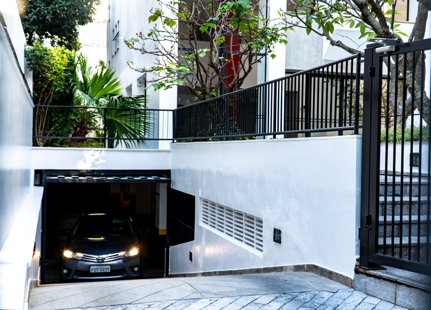 A car rolling out of an underground garage