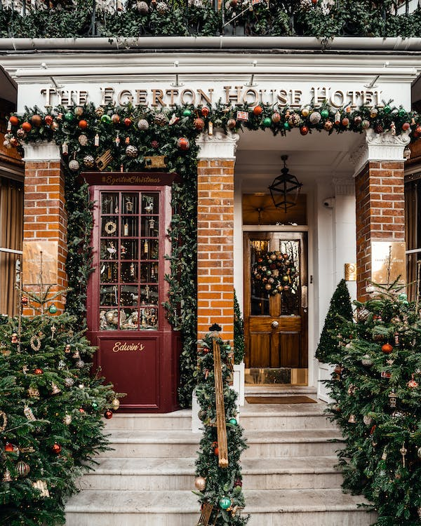 a front door decorated with beautiful Christmas decorations