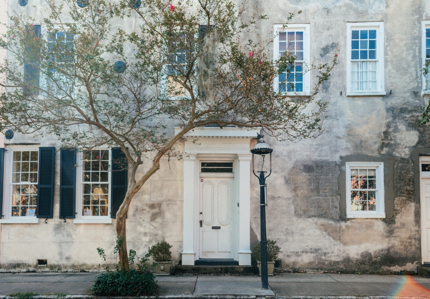 Aesthetic Concrete Building with a White Front Door
