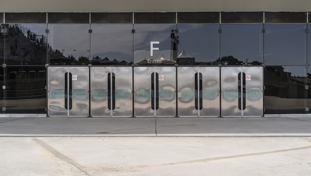 Glass building with impact-traffic doors